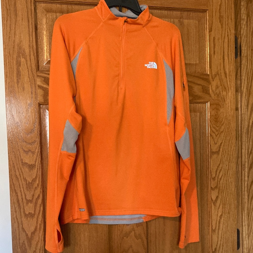 The North Face Vibrant Orange quarter zip jacket with gray accents